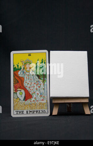 The Empress tarot card next to a blank canvas. Stock Photo