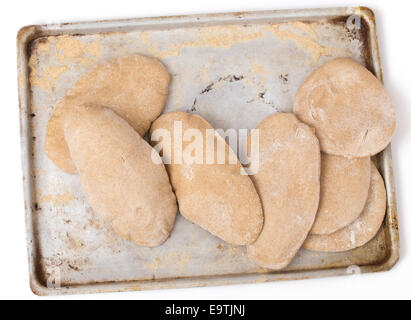 Loaves of traditional Egyptian homemade brown pita bread, fresh from the oven. called aish baladi Stock Photo