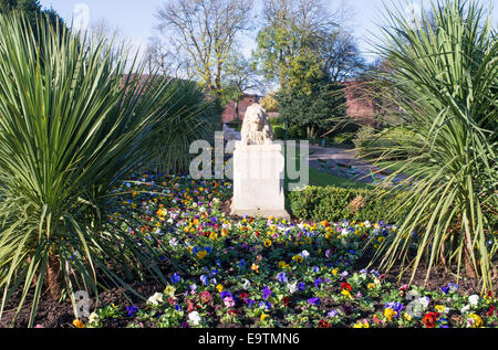 Lion statue and winter bedding plants within Mowbray Park, Sunderland, north east England. Stock Photo