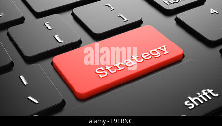 Strategy on Red Button Enter on Black Computer Keyboard. Stock Photo