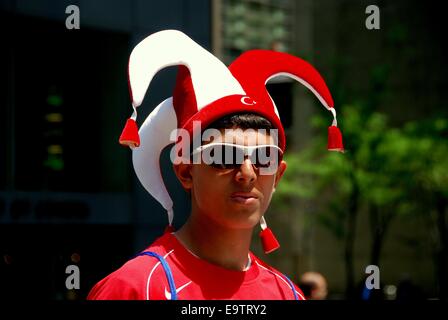 NYC:  Young man wearing jester hat at the Turkish Day Parade on Madison Avenue Stock Photo