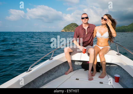 Young woman and man in swimsuits enjoying a private boat tour to Los Arcos National Marine Park, Pacific ocean, Banderas Bay, Me Stock Photo
