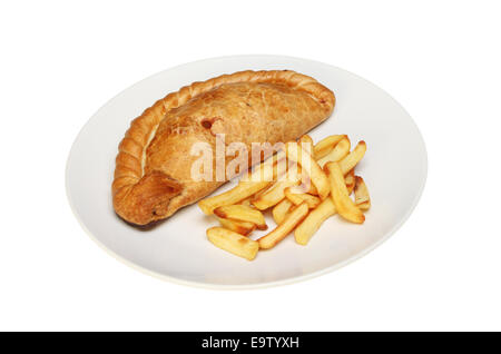 Cornish pasty and chips on a plate isolated against white Stock Photo