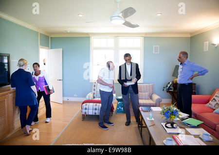 President Barack Obama talks with Ben Rhodes, Deputy National Security Advisor for Strategic Communications, regarding a statement on Iraq and the situation in Ferguson, Missouri, in Chilmark, Martha's Vineyard, Mass., Aug. 14, 2014. Attorney General Eric Stock Photo