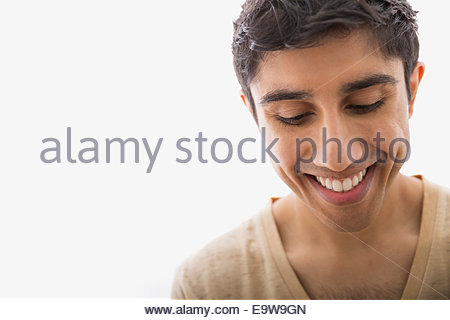 Close up portrait of smiling man looking down