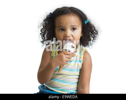 mulatto kid eating ice cream isolated Stock Photo