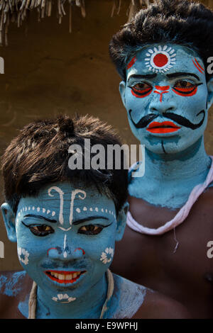 Two people painted faces celebrating Gajan festival, Kolkata, West Bengal, India Stock Photo