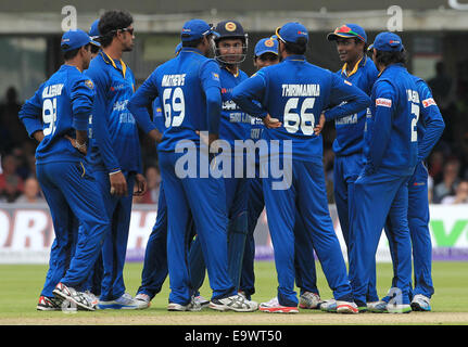 Cricket - Sri Lanka players celebrate taking an England wicket in a One Day International match at Lord's in 2014. Stock Photo