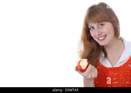 young girl eating ripe apple Stock Photo