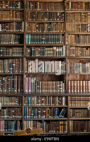 Religious books in an old library, UK Stock Photo