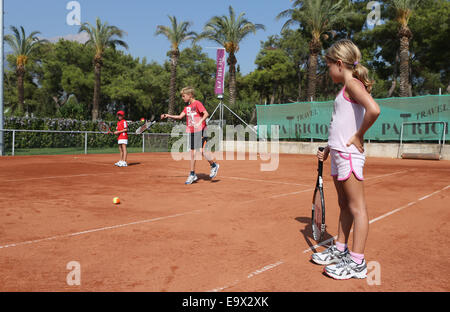 Children learning to play tennis. Stock Photo