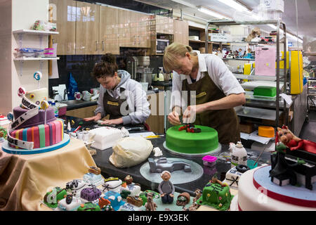 Two women decorating cakes, The Cake Shop in the Covered Market, Oxford, England Stock Photo