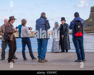 Whitby Goth Weekend when people dressed in costume frequently offer to be photographed with a number of photographers obliging Stock Photo