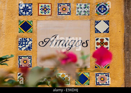 Horizontal close up of patterned tiles decorating a wall. Stock Photo