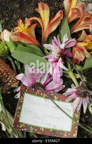 Clear Lake, IOWA, USA. 5th Oct, 2014. Flowers and a note from a fan in Sweden at a memorial at the spot where the plane carrying Buddy Holly, Ritchie Valens and J.P. ''The Big Bopper'' Richardson crashed killing all aboard on Feb. 3, 1959, North of Clear Lake, Iowa. The three young singers were in a single-engine aircraft flying in a light snowstorm in 1959 when the pilot apparently lost control. Holly decided to fly because his tour bus was having heating problems. Fans from all over the world come to the site every year. © Kevin E. Schmidt/ZUMA Wire/Alamy Live News Stock Photo