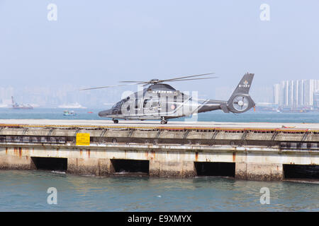 helicopter  takes off at the heliport on sea Stock Photo
