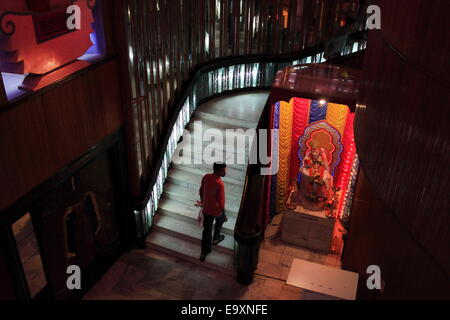 Mumbai, Maharashtra, India. 10th Oct, 2014. A patron arrives at the Maratha Mandir Cinema at Mumbai Central. The Hindi romantic Bollywood film 'Dilwale Dulhania Le Jayenge' has started its 20th year of uninterrupted run at the iconic Maratha Mandir cinema hall. It is the longest running film in the history of cinema. Release Oct 20, 1995, the classic love story still plays to packed houses. © Subhash Sharma/ZUMA Wire/ZUMAPRESS.com/Alamy Live News Stock Photo