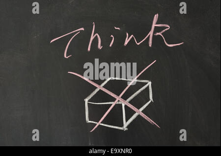 Think outside the box concept on blackboard Stock Photo