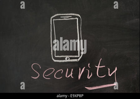 Security word with mobile phone on blackboard Stock Photo