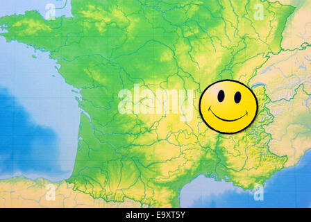 Yellow happy face on France map, close up image. Stock Photo