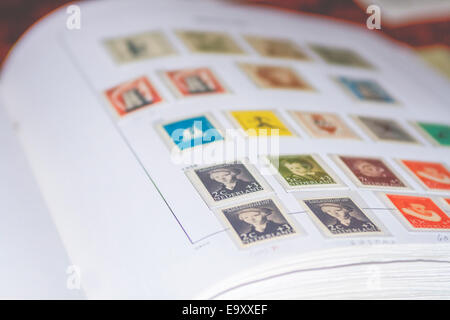 Old Dutch stamps in album. Stock Photo