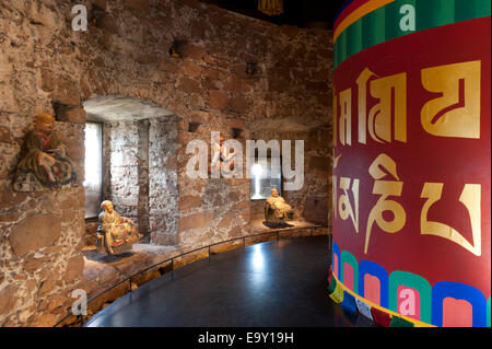 Room with a Tibetan prayer wheel and Buddha statues, Messner Mountain Museum Firmian from Reinhold Messner Stock Photo