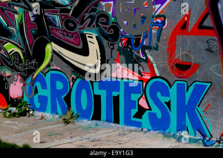 Berlin wall graffiti Grotesk colour pavement Stock Photo