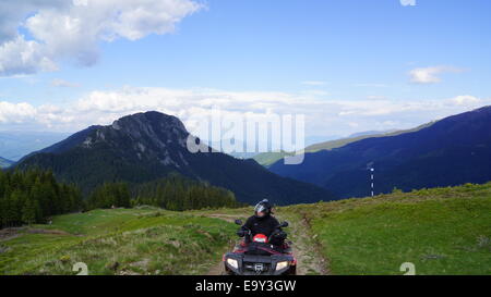 Driving ATVs in beautiful landscapes. Stock Photo