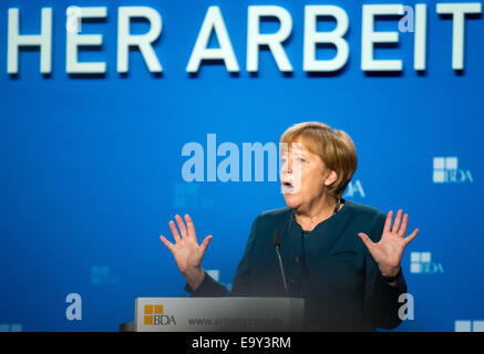 Berlin, Germany. 04th Nov, 2014. German Chancellor Angela Merkel speaks during the German Employers' Conference in Berlin, Germany, 04 November 2014. The annual conference serves as a place to exchange ideas between top representatives from politics, business and society. Photo: BERND VON JUTRCZENKA/dpa/Alamy Live News Stock Photo