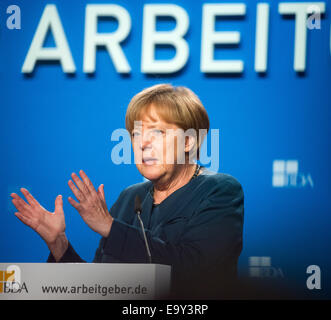 Berlin, Germany. 04th Nov, 2014. German Chancellor Angela Merkel speaks during the German Employers' Conference in Berlin, Germany, 04 November 2014. The annual conference serves as a place to exchange ideas between top representatives from politics, business and society. Photo: BERND VON JUTRCZENKA/dpa/Alamy Live News Stock Photo