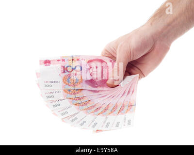 Male hand holding Chinese Yuan 100 bills Renminbi money currency isolated on white background Stock Photo