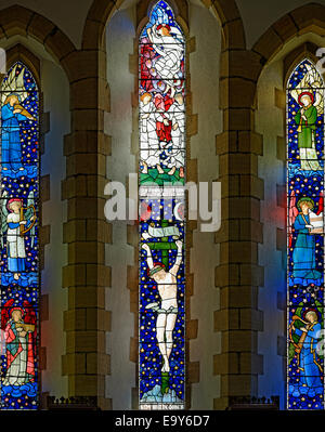 'Christ's crucifixion and ascent into heaven' by Edward Burne Jones and William Morris, Staveley Church, Lake District, England Stock Photo