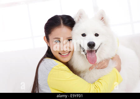 Young woman with dog Stock Photo