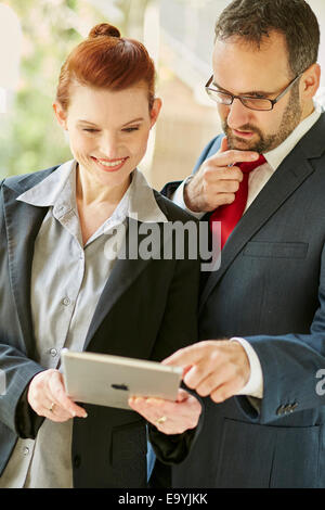 Two business people discussing work Stock Photo