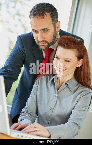 Two business people discussing work Stock Photo