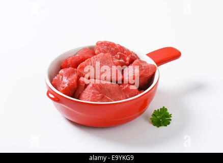 Raw diced beef in a pan Stock Photo