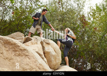 Couple rock climbing Stock Photo