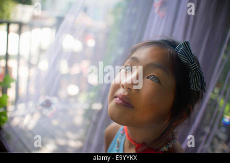 Portrait of young asian girl, head and shoulders, close-up Stock Photo