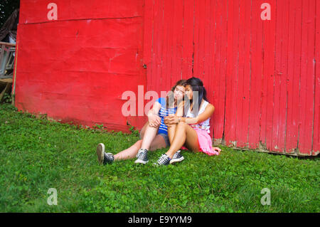 Two teenagers relaxing outdoors Stock Photo