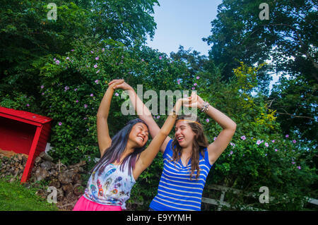 Two teenagers dancing, outdoors Stock Photo