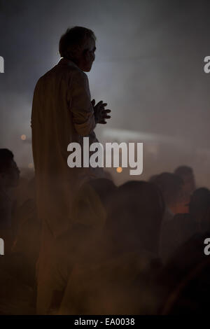 Narayangonj, Bangladesh. 4th Nov, 2014. People of Hindu Community (Bangladeshi) celebrating 'Rakher Upobas''a culture in every Bengali month Kartik. It's a fast day for keeping safe all of own family members from all kinds of black issues. Hindu Man and Women are celebrating this ritual festival by lighting lamps and candles from just sunset with some gift (fruits, sweets, coconut, cow milk etc.) for their belief 'Baba Loknath'' Hindus one of the God. And every fans keep themselves fasting until the lamps burn-out. Credit:  ZUMA Press, Inc./Alamy Live News Stock Photo