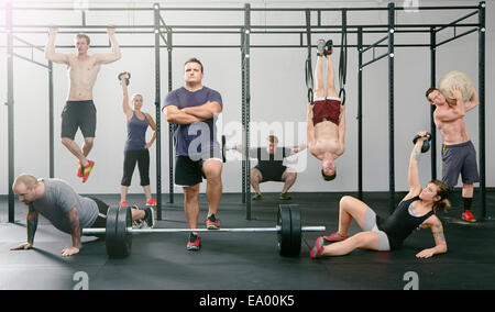 Portrait of eight men and women active in gym Stock Photo