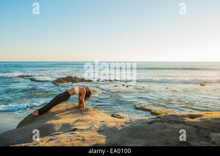 Reverse plank pose, Windansea beach, La Jolla, California Stock Photo