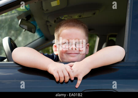 little boy car driver behind the wheel Stock Photo