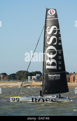 The Ocean Racing Boat, Hugo Boss, crewed by Alex Thomson, departing Gosport and heading into the Solent for sea trials. Stock Photo