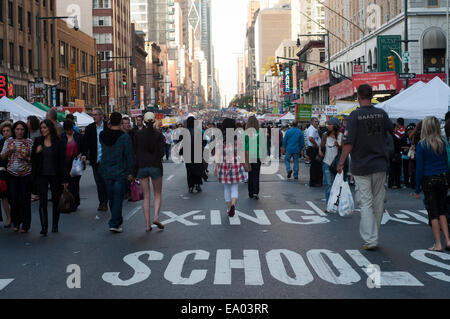 Crowds clog Broadway in Times Square after the city began closing sections of the street. Traffic was diverted to Seventh Avenue Stock Photo