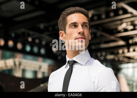 Young confident businessman outside station, London, UK Stock Photo