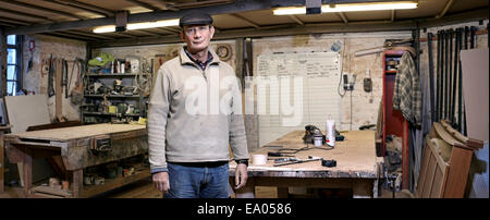 Portrait of a cabinet maker in his working environment Stock Photo