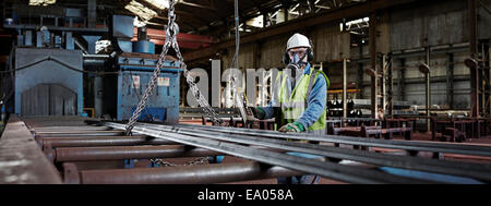 Portrait of a steelworker in his working environment Stock Photo