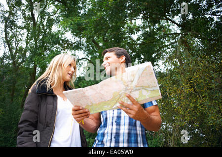 Couple map reading on walk Stock Photo